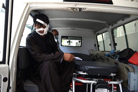 A wounded man is brought by ambulance to the Wazir Akbar Khan hospital following a suicide attack in Kabul. (Photo | AFP)