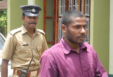 The police bringing Kari Satheesh the first accused in the Paul George murder case to th court. (File Photo | EPS)