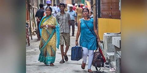 Residents carry their belongings as they evacuate Bowbazar area where several houses have been damaged owing to tunnel boring for East-West Metro corridor in Kolkata Friday September 6 2019. (Photo | PTI)