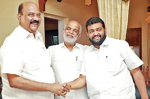 LDF candidate Mani C Kappen, UDF candidate Jose Tom and NDA candidate N Hari greet each other at an election related-programme in Pala on Friday | Express