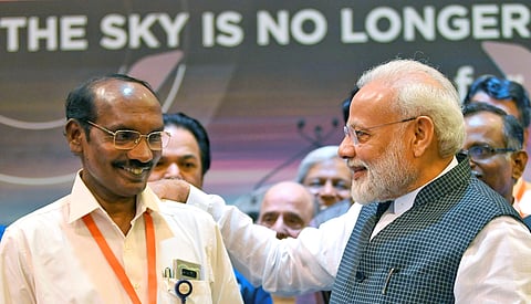PM Narendra Modi interacts with ISRO Chairman K Sivan after connection with the Vikram lander was lost during soft landing of Chandrayaan 2 on lunar surface. (Photo | PTI)