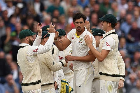 Australia's Mitchell Starc (C) celebrates with teammates after taking the wicket of England's Jonny Bairstow for 17 during the fourth day of the fourth Ashes cricket Test match. (Photo | AFP)
