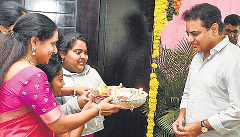 KT Rama Rao being greeted by his sister Kavitha at their home on Sunday. (Photo | EPS)