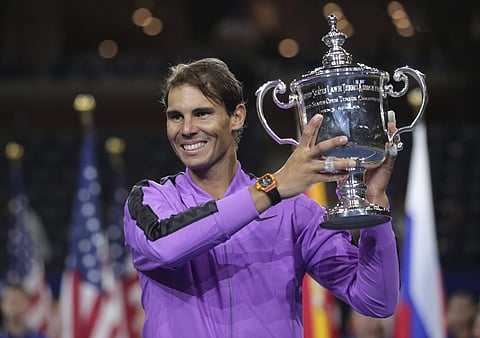 Rafael Nadal holds up the championship trophy after defeating Daniil Medvedev, of Russia, to win the men's singles final of the U.S. Open tennis championships. (Photo | AP)