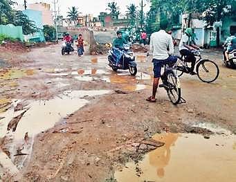 The over bridge construction led to blocking of the road and as a result, people are forced to take an alternative route which is just a muddy stretch.