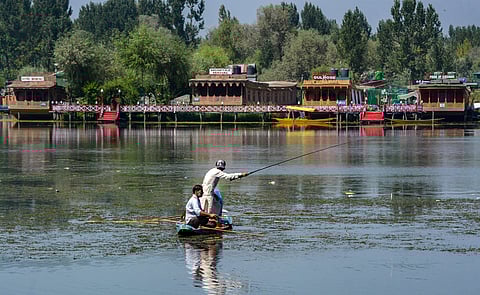 Residents fish on a deserted Dal lake during restrictions after the abrogration of Article of 370 and bifurcation of state in Srinagar Monday September 9 2019. | PTI