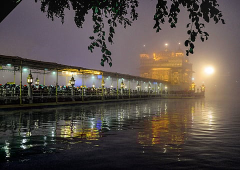 Sikh devotees queue to pay obeisance on a foggy New Year s Day morning at the Golden Temple in Amritsar Wednesday Jan. 1 2020. (Photo | PTI)