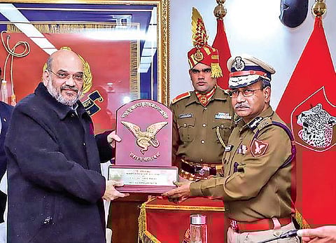 Union Home Minister Amit Shah being presented a memento by Director General of Sashastra Seema Bal, Kumar Rajesh Chandra, during a visit to the force’s headquarters, in New Delhi on Tuesday | PTI