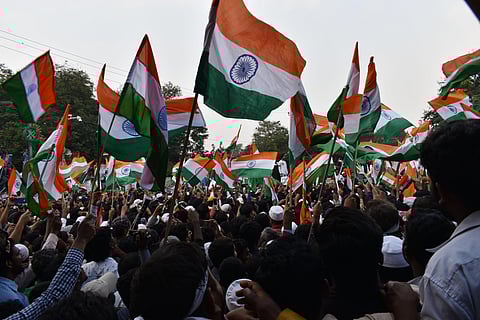 Waiving the Tricolour, shouting slogans and holding posters and banners against the Citizenship Amendment Act (CAA), thousands of people hit the streets of Hyderabad on Saturday bringing the city to a grinding halt (Photo | S Senbagapandiyan, EPS)