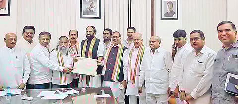 Sangareddy MLA Jagga Reddy receives B-forms from TPCC chief Uttam Kumar Reddy, in Hyderabad on Friday