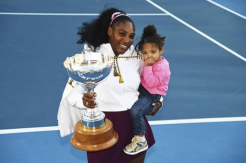 Serena Williams from the United States with daughter Alexis Olympia Ohanian Jr. and the ASB trophy after winning her singles finals match against United States Jessica Pegula at the ASB Classic in Auckland, New Zealand. (Photo | AP)