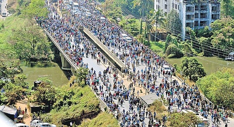 Public gathered at Kundannoor bridge to witness the demolition of the Maradu highrises | A Sanesh