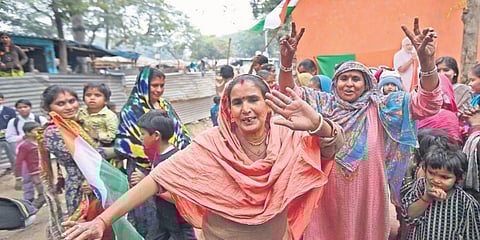 Hindu refugees from Pakistan celebrate the passing of the Citizenship Amendment Bill, at Majnu-ka-tilla (MKT), in New Delhi on  (Photo| PTI)