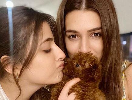 Kriti took to Instagram where she shared a photograph of herself holding the puppy along with her sister Nupur Sanon. (Photo | Instagram)