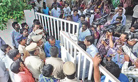 Police assist a special branch police officer who was detained by Mandadam villagers for entering a private property on Sunday| Prasant Madugula