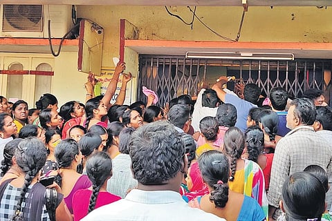 Women queue up at a bank in Krishna Lanka in Vijayawada on Monday,  to withdraw financial aid under Amma Vodi scheme| Express