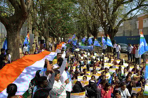NSUI teachers and students protest against CAA on Kalidasa Road near Freedom Park in Bengaluru on Monday. (Photo | Meghana Shastry/EPS)