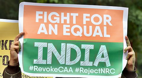 Activists hold placards during anti-Citizenship Act protest. (Photo| PTI)