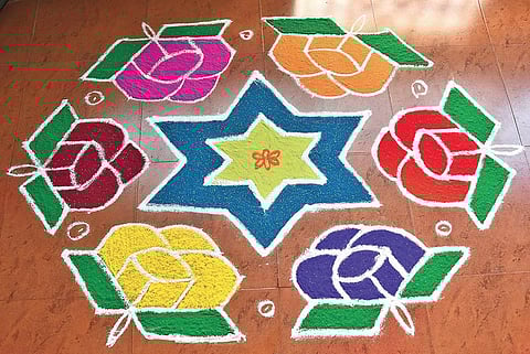 The Srinivasan family decide on the kolam design for the day, the previous night  Ashwin Prasath