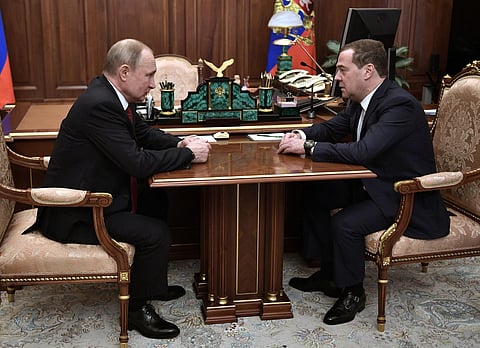 Russian President Vladimir Putin, left, listens to Russian Prime Minister Dmitry Medvedev during their meeting in the Kremlin in Moscow, Jan. 15, 2020. (Photo | AP)