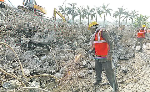Workers removing the debris from the site of the now-demolished Holy Faith H20 at Maradu on Wednesday | Arun Angela