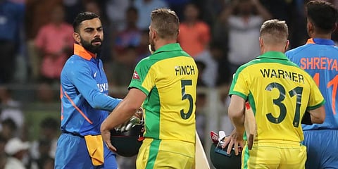 Australia's captain Aaron Finch, second from right, is congratulated by Indian captain Virat Kohli, left, after Australia won the first ODI match between India and Australia in Mumbai. (Photo | AP)