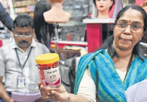 Officials raiding the shop at Marine Drive on Thursday | A Sanesh
