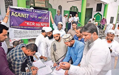 Muslims sign petitions addressed to Chief Minister K Chandrasekhar Rao at a masjid in Hyderabad on Friday as part of the ‘KCR no NPR’ campaign| Vinay Madapu