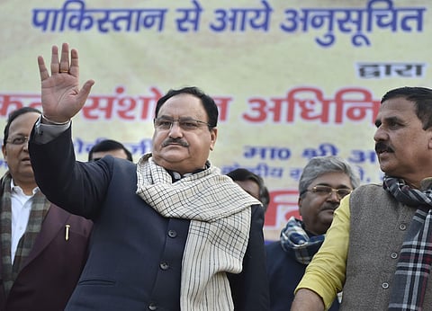 BJP Working President J P Nadda C waves at refugees of Dalit community and other Hindu communities from Pakistan who held a rally in support of CAA at party headquarters in New Delhi Saturday Jan. 18 2020. (Photo | PTI)