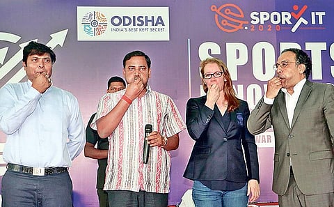 Sport Minister Tusharkanti Behera blowing whistle to inaugurate Sports Innovation Entrepreneurship at Kalinga Stadium in Bhubaneswar on Saturday| IRFANA