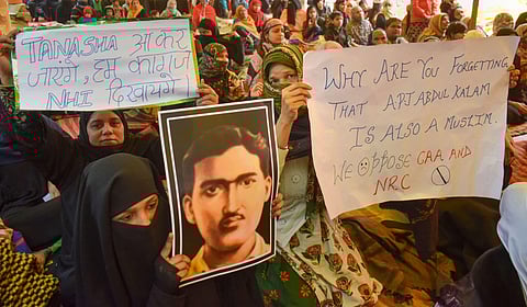 Muslim women hold placards during the sixth day of their protest against CAA and NRC at a park in Prayagraj Allahabad Saturday Jan. 18 2020. (Photo | PTI)