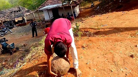 'Illavata Kal', a traditional sport where men lift heavy spherical stones. (Photo | YouTube  Screengrab)