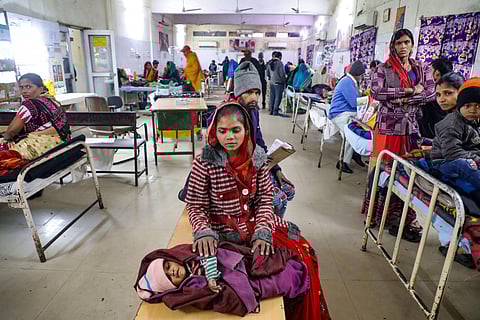 A mother waits for treatment of her child at the JK Lone hospital in Kota district Thursday Jan. 2 2020. (Photo | PTI)