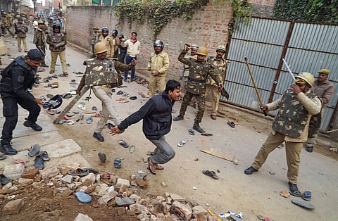 Police personnel baton charge protestors demonstrating against the Citizenship Amendment Act in Varanasi Friday Dec. 20 2019. (File Photo | PTI)