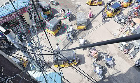 Tangled wires and cables hanging from a lamp post at Sowcarpet. (Photo | R Satish Babu, EPS)