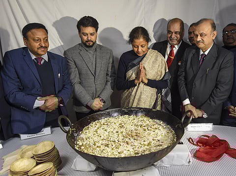 Finance Minister Nirmala Sitharaman C and Minister of State for Finance Anurag Singh Thakur 2L Finance Secretary Rajiv Kumar L Economic Affairs Secretary Atanu Chakraborty R and others during 'Halwa' ceremony marking the commencement of Budget printing pr