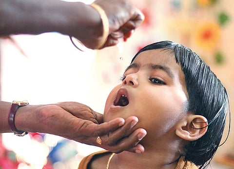 A child being administered pulse polio drops at a booth in Marutheri Anganwadi in Kozhikode  on Sunday (File Photo | TP Sooraj, EPS)