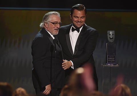 Leonardo DiCaprio, right, presents the lifetime achievement award to Robert De Niro at the 26th annual Screen Actors Guild Awards. (Photo | AP)