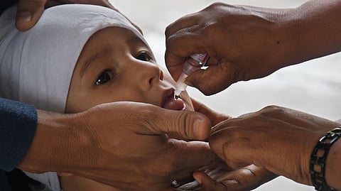 Medical staff administering polio drops to a baby. Representational image.