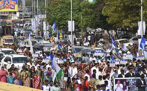 YSR Congress activists organised a rally in favour of three capitals at BRTS road in Vijayawada on Sunday. (Photo| P Ravindra Babu, EPS)