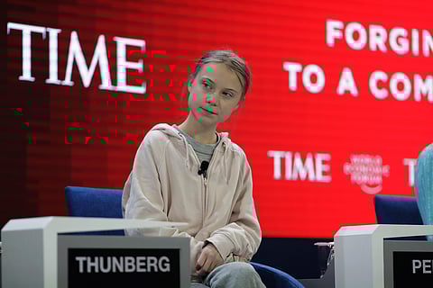 Swedish environmental activist Greta Thunberg takes her seat prior to the opening session of the World Economic Forum in Davos. (Photo | AP)