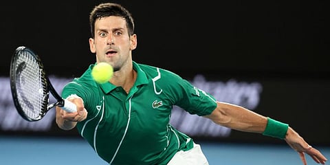 Serbia's Novak Djokovic makes a forehand return to Germany's Jan-Lennard Struff during their first round singles match at the Australian Open tennis championship in Melbourne. (Photo | AP)