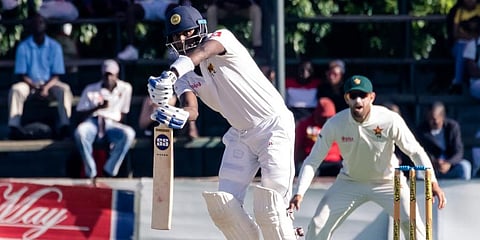 Sri Lanka batsman Angelo Mathews is in action as slip fielder Craig Ervine looks on during the third day of the first Test cricket match played between Zimbabwe and Sri Lanka at the Harare Sports Club in Harare. (Photo | AFP)