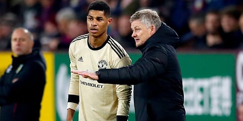 Manchester United boss Ole Gunnar Solskjaer with striker Marcus Rashford (Photo | AP)