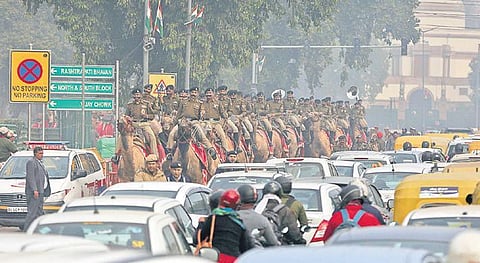 A marching contingent of the Sashastra Seema Bal camel unit returns after Republic Day parade rehearsal amidst heavy traffic near India Gate. (PHOTO | SHEKHAR YADAV, EPS)
