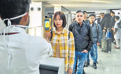 A thermal screeening device checks passengers arriving in India from China and Hong Kong at an airport in Kolkata on Tuesday in view of the outbreak of the novel coronavirus (CoV) in China. (File Photo)