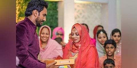 Ijas Hakkim presenting books as mehr to his bride Ajna Nazim on their wedding day| Express