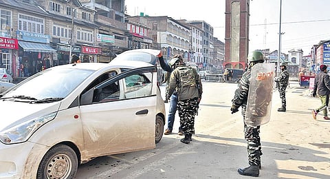 CRPF personnel check vehicles ahead of Republic Day in Srinagar on Thursday.  (Photo | Zahoor Punjabi/EPS)
