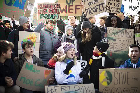 Climate activist Greta Thunberg (C) joins a 'fridays for future' demo on the final day of the 50th annual meeting of the World Economic Forum in Davos, Switzerland. (Photo | AP)