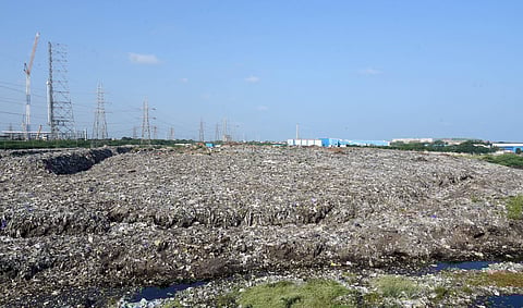 The dumpyard, alongside the Buckingham Canal Road, has legacy waste upto 1.25 lakh cubic metres spread across 17.39 acres and more than 10 feet deep.  | Martin Louis, EPS
